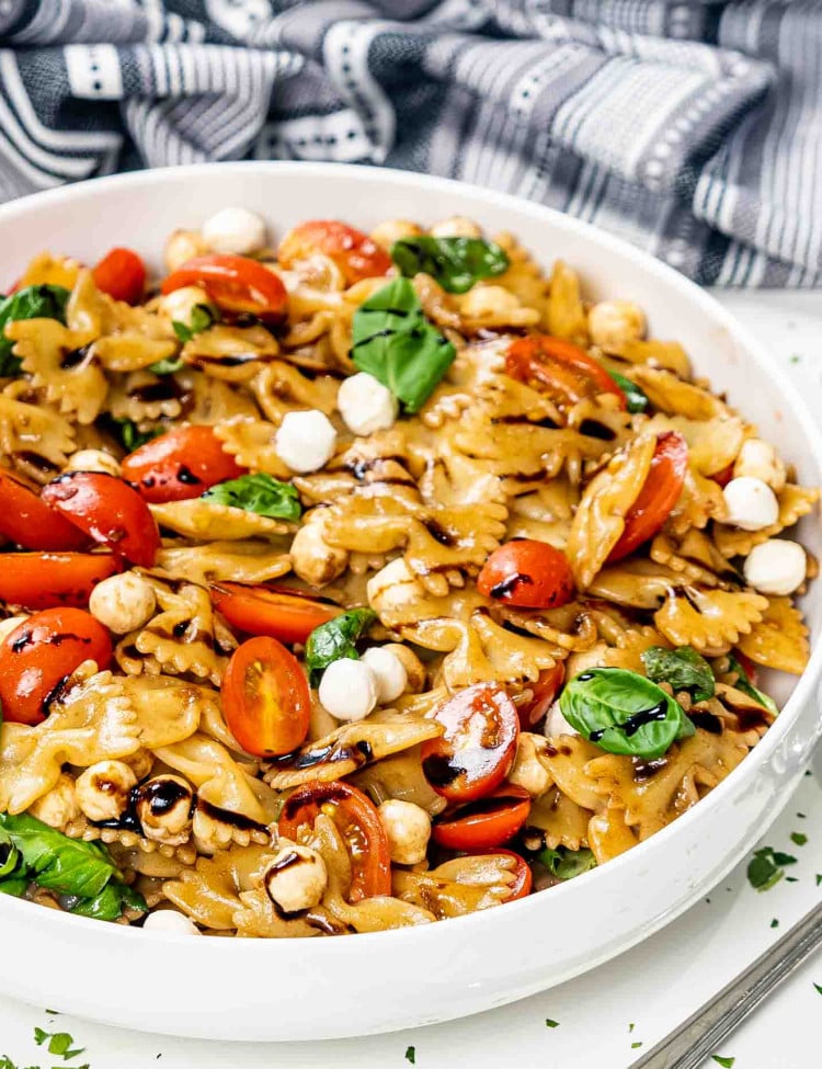 a white bowl with freshly made caprese salad.