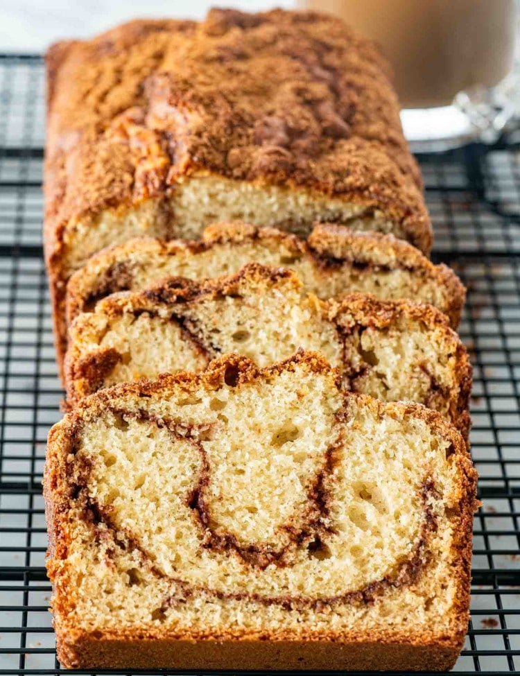 slices of freshly baked coffee cake bread on a cooling rack.