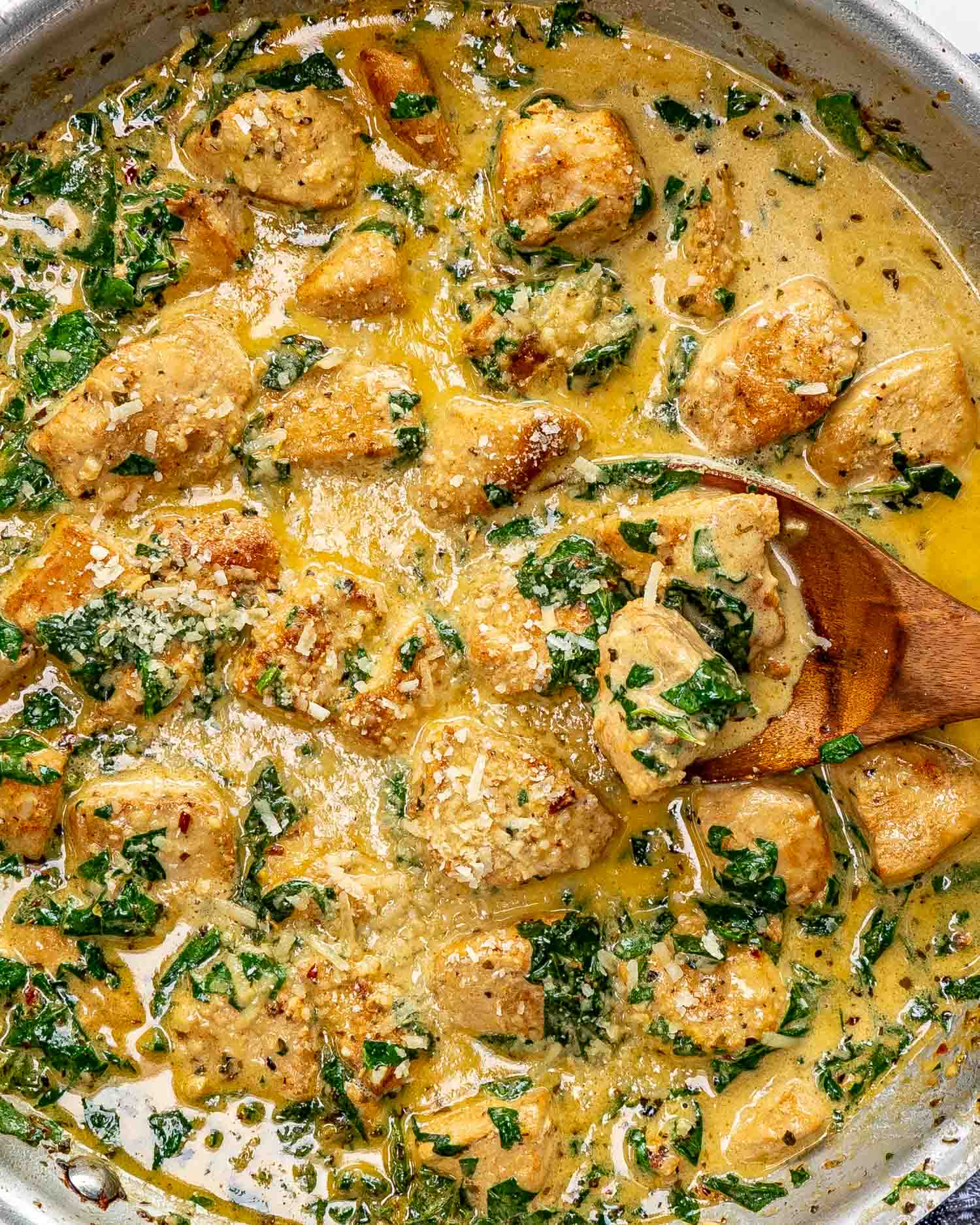 freshly made creamy butter lemon chicken in a stainless skillet.