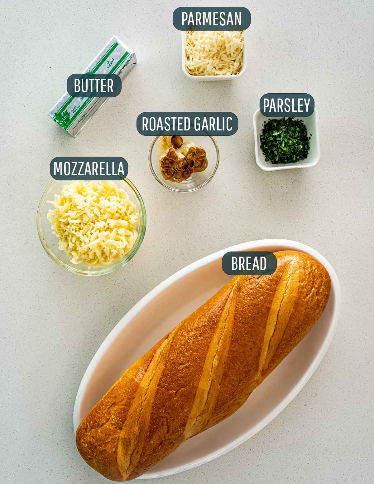 overhead shot of ingredients needed to make garlic bread.