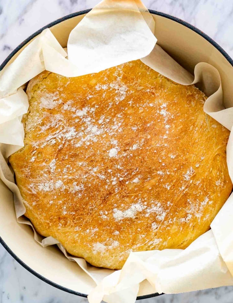 a no knead bread in a dutch oven fresh out of the oven.