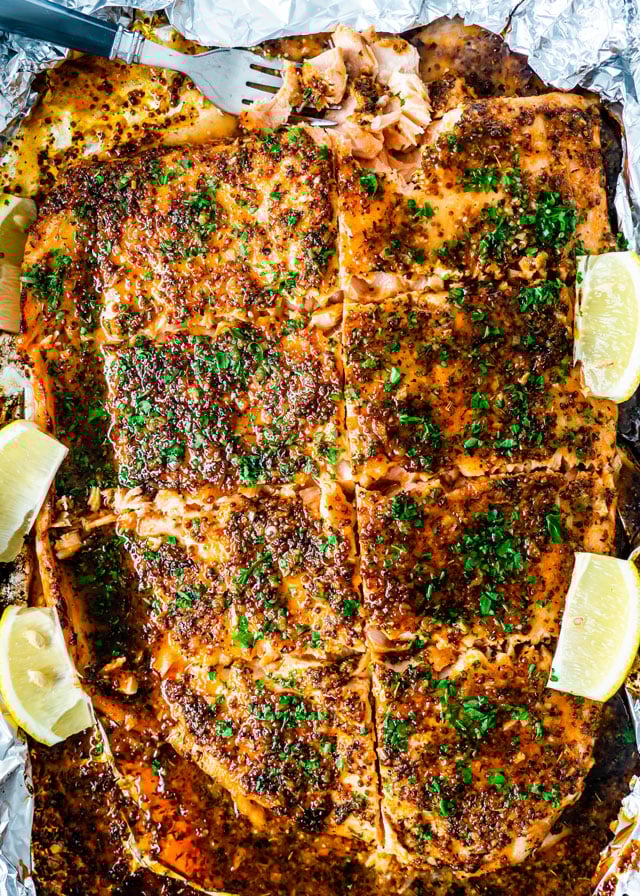 overhead shot of honey mustard salmon with a fork taking a bite