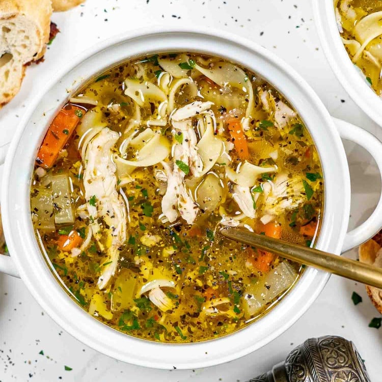 instant pot chicken noodle soup in a white bowl.
