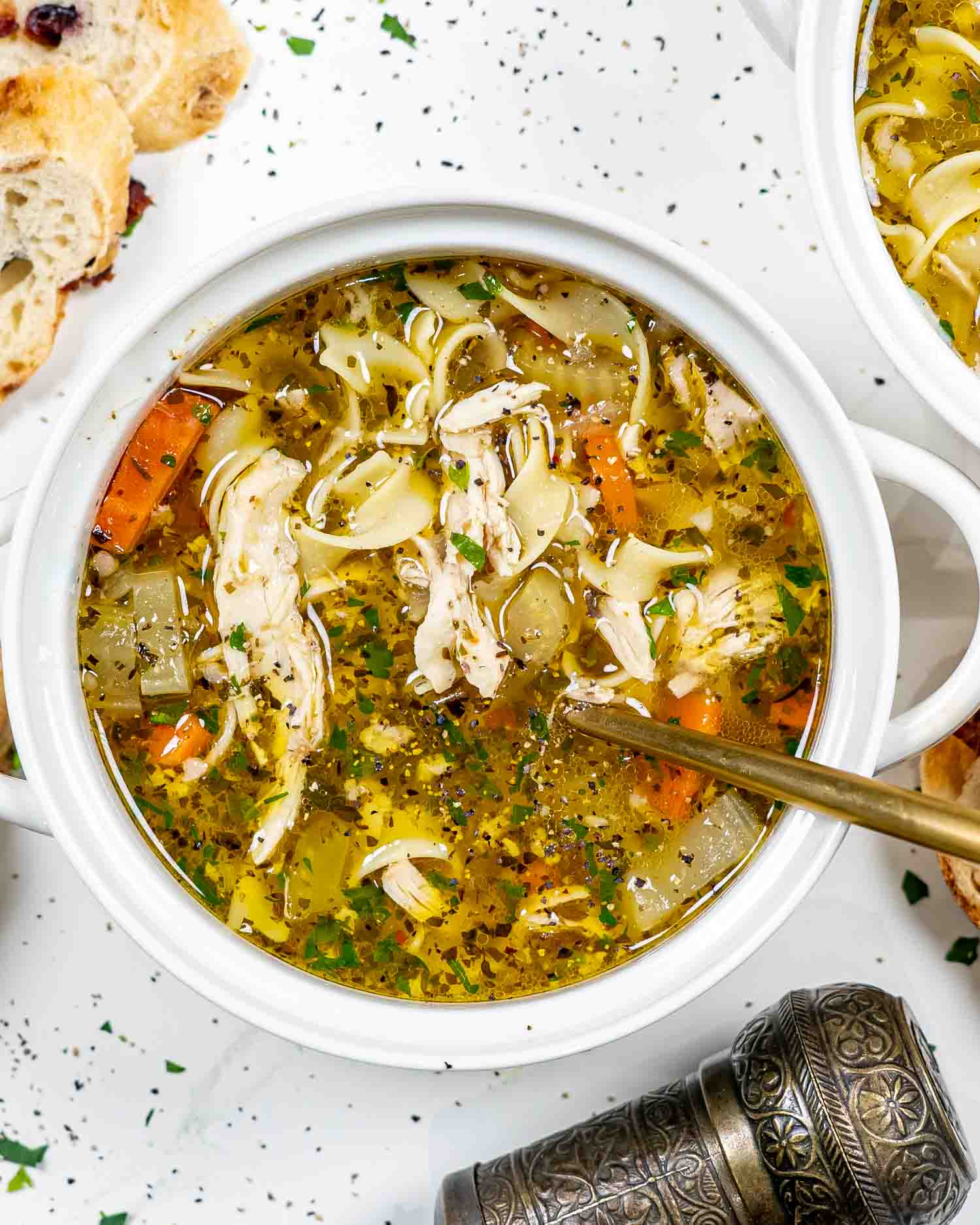 instant pot chicken noodle soup in a white bowl.