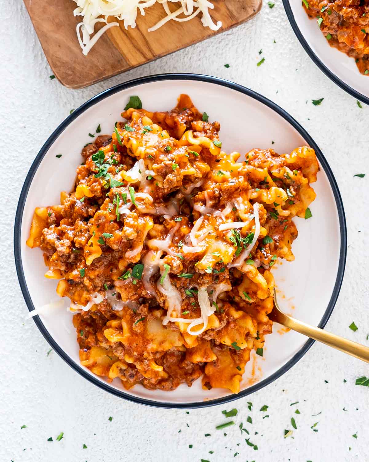 a serving of hamburger helper lasagna in a white plate.