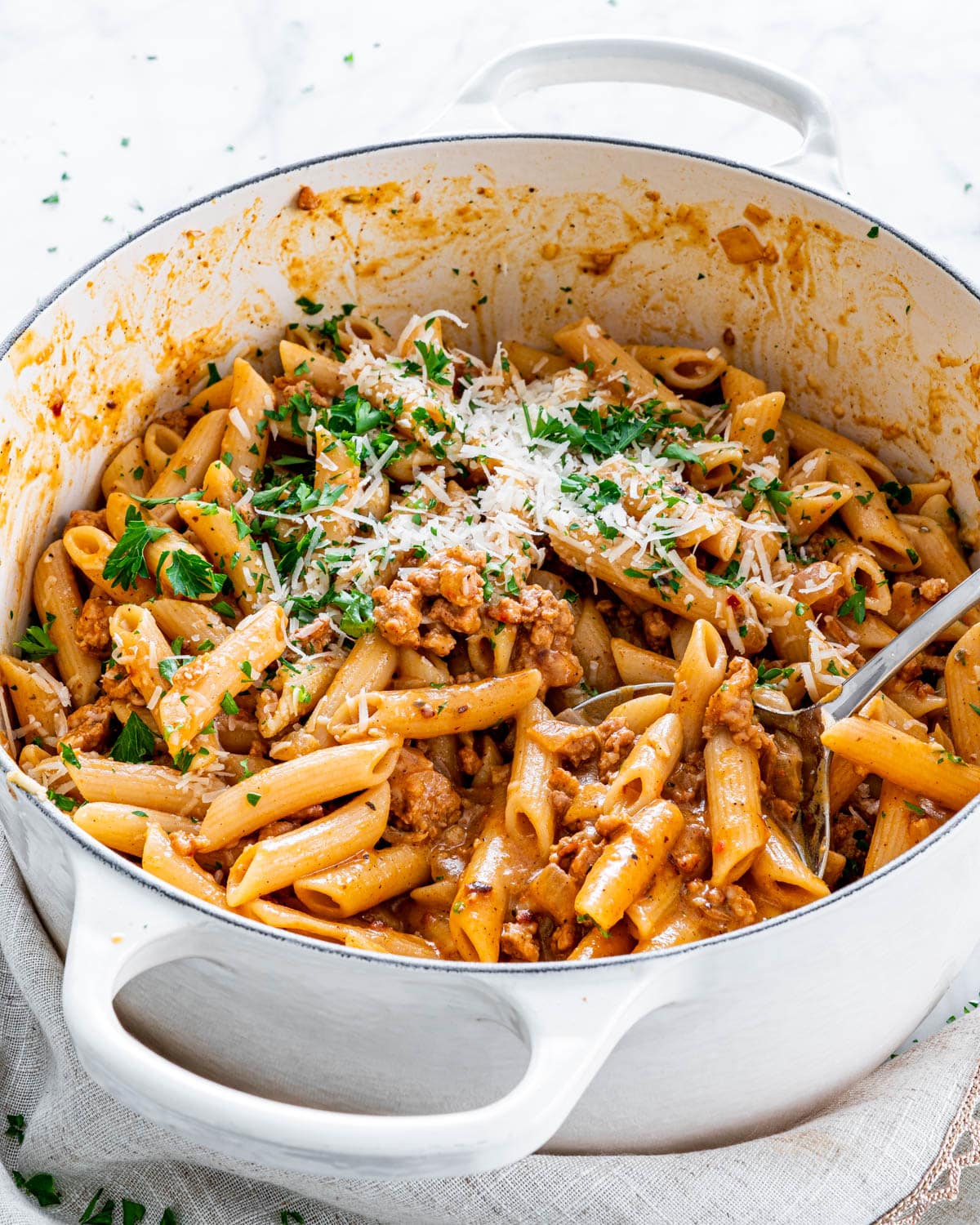 pasta with pumpkin and sausage in a dutch oven
