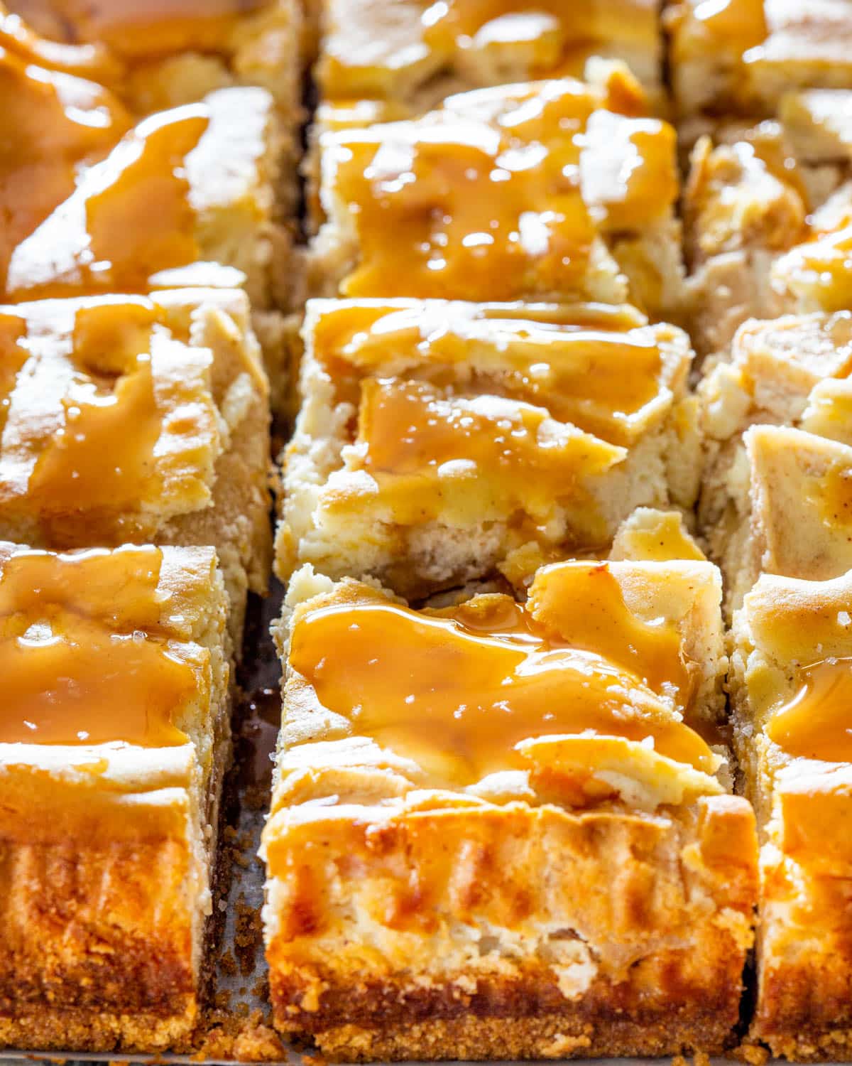 salted caramel apple pie cheesecake cut into squares