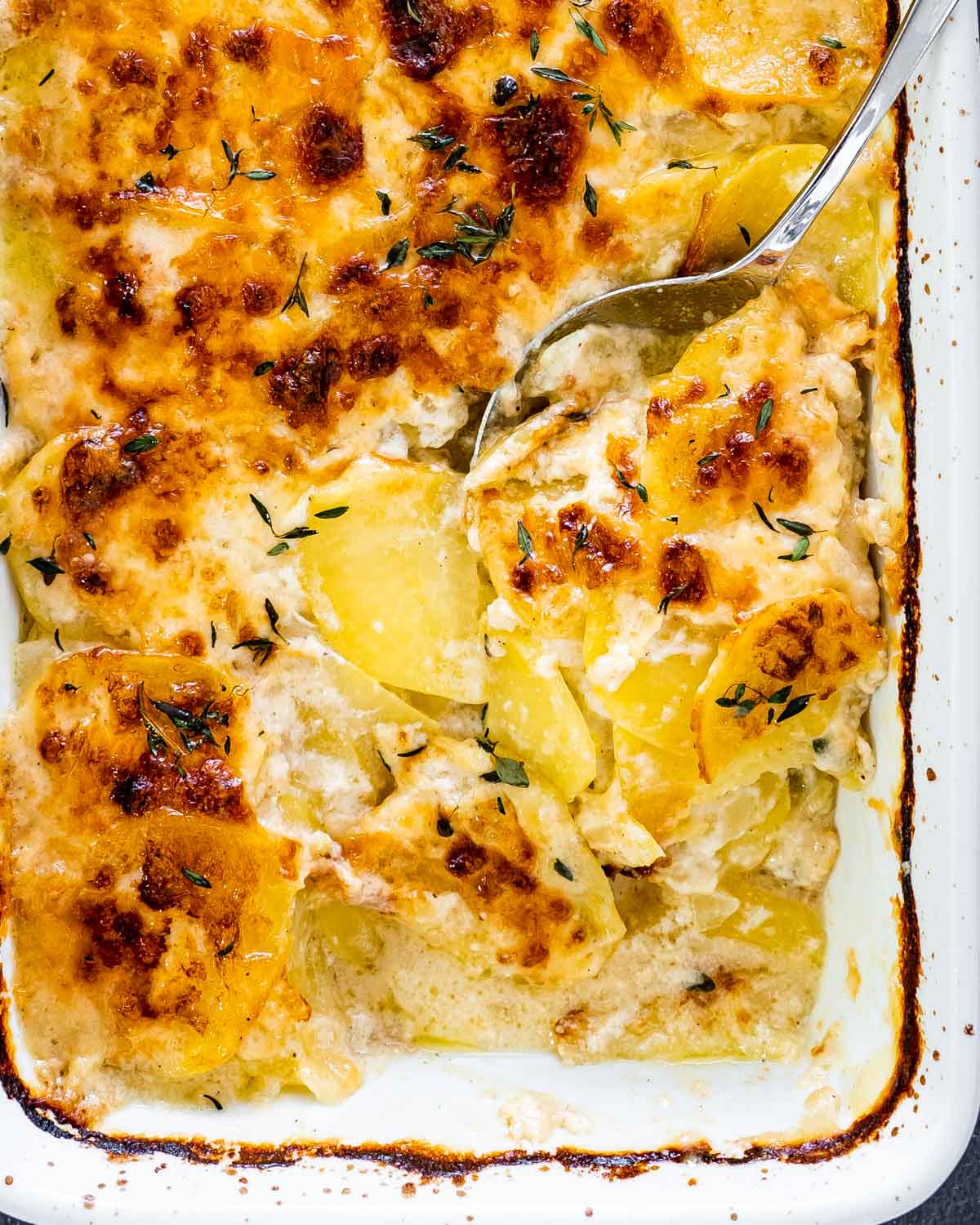 freshly made potatoes au gratin in a casserole dish.