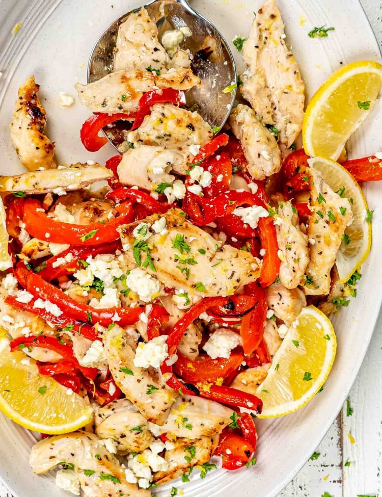 sheet pan lemon honey garlic chicken on a white serving platter.