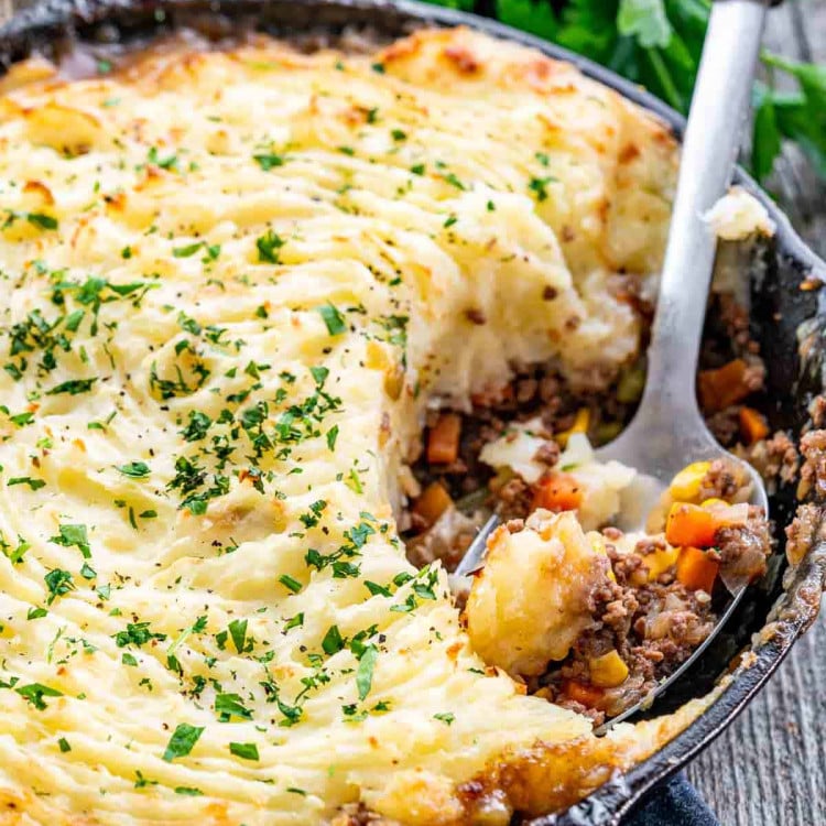 skillet shepherd's pie with a serving spoon inside the skillet.