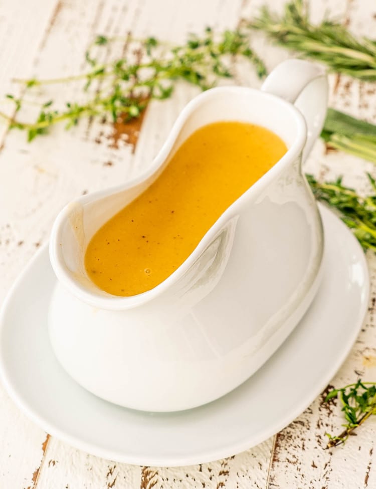 a gorgeous white gravy bowl with turkey gravy.