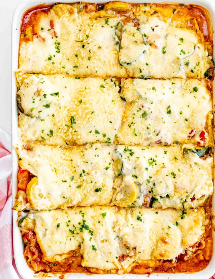 vegetable lasagna in a casserole dish fresh out of the oven.