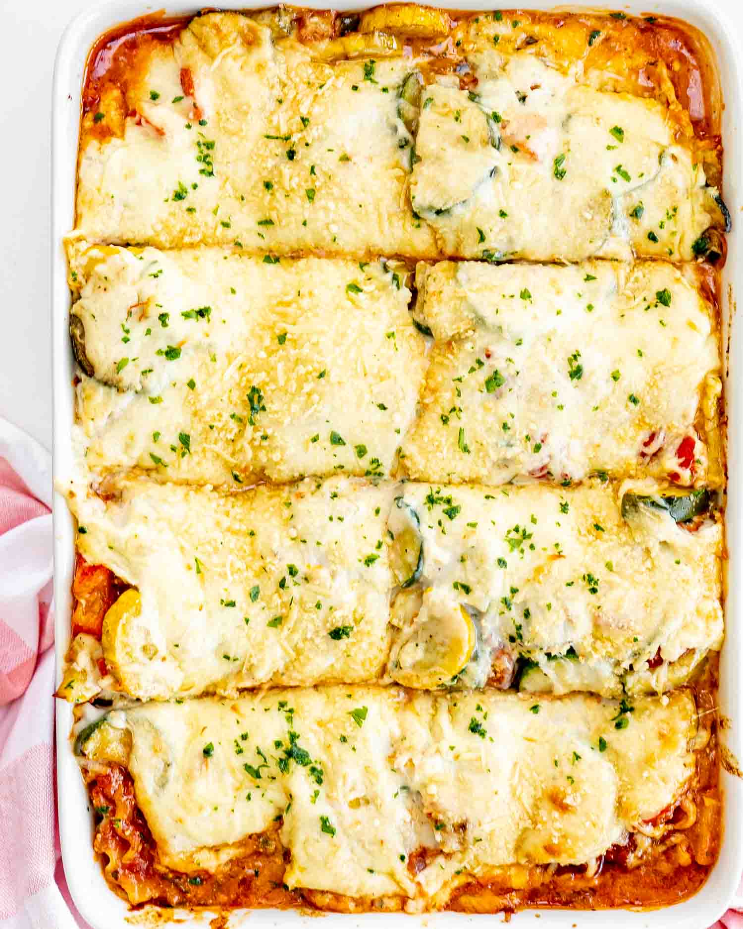 vegetable lasagna in a casserole dish fresh out of the oven.