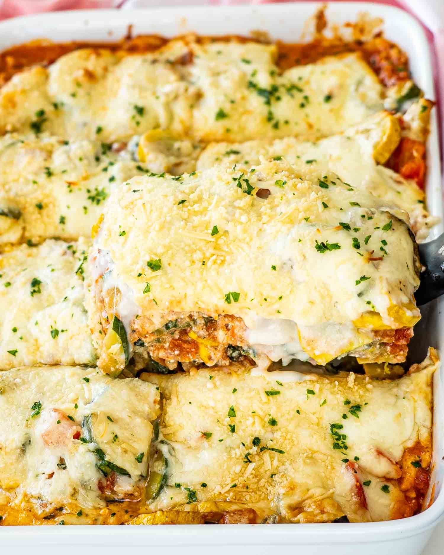 vegetable lasagna in a casserole dish fresh out of the oven.