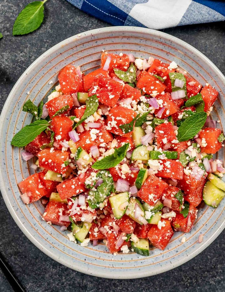 fresh watermelon salad in a blue bowl.
